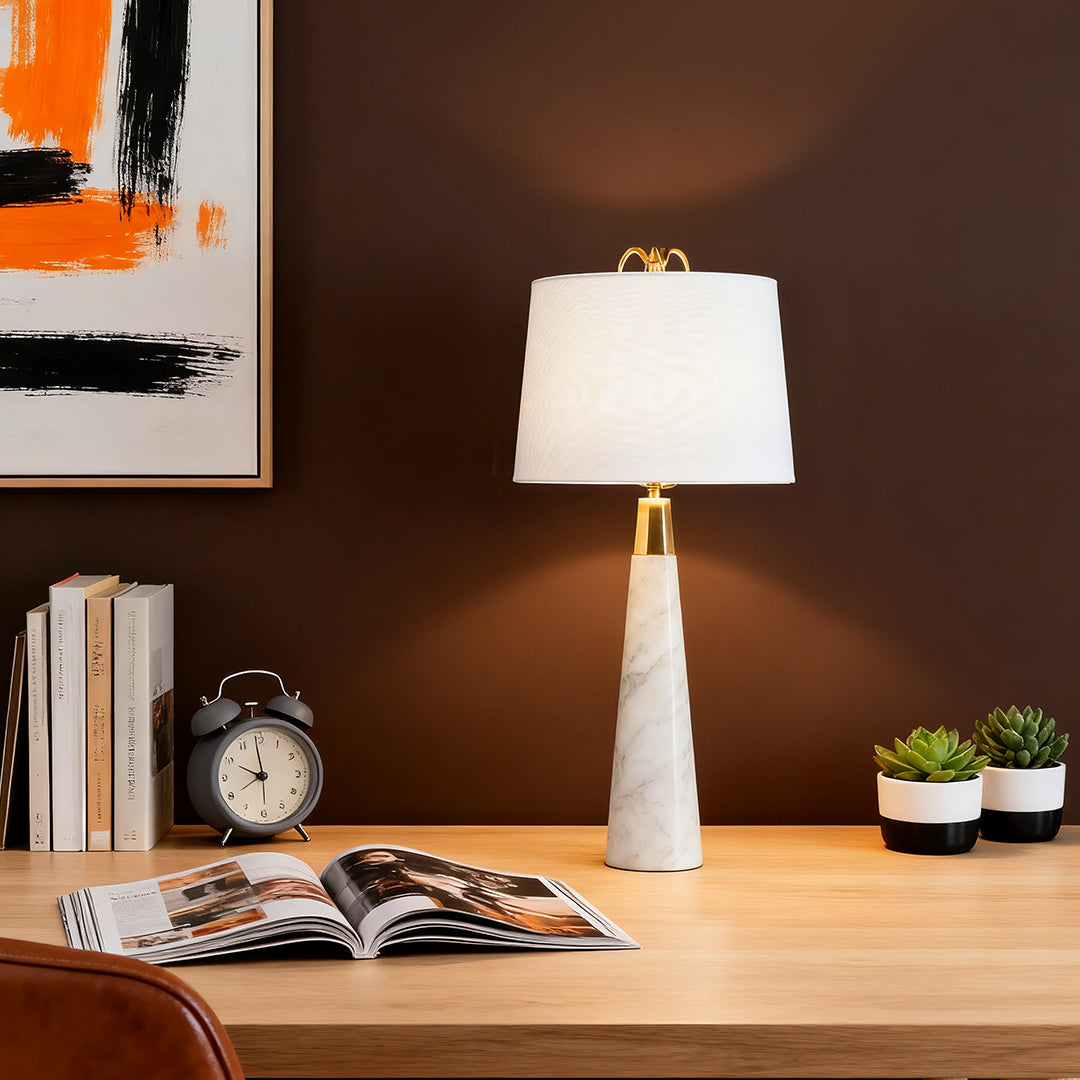 White marble table lamp with beige lampshade in a stylish home office