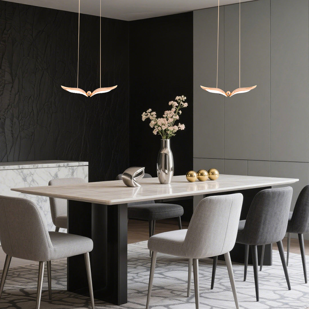 Stylish bird pendant light table with clean lines illuminating minimalist dining area