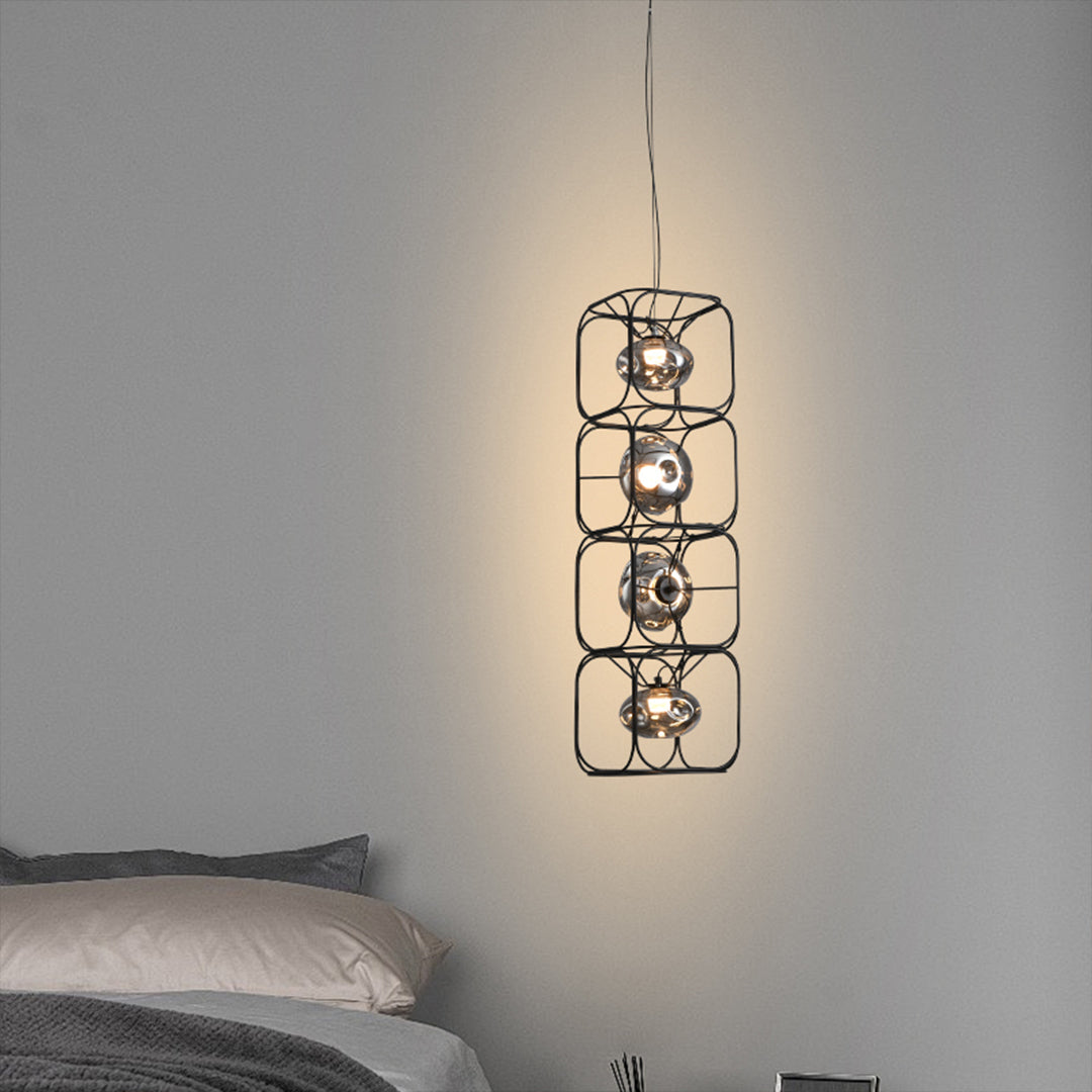 Stylish caged pendant light positioned over bedside area showcasing industrial wire frame aesthetic
