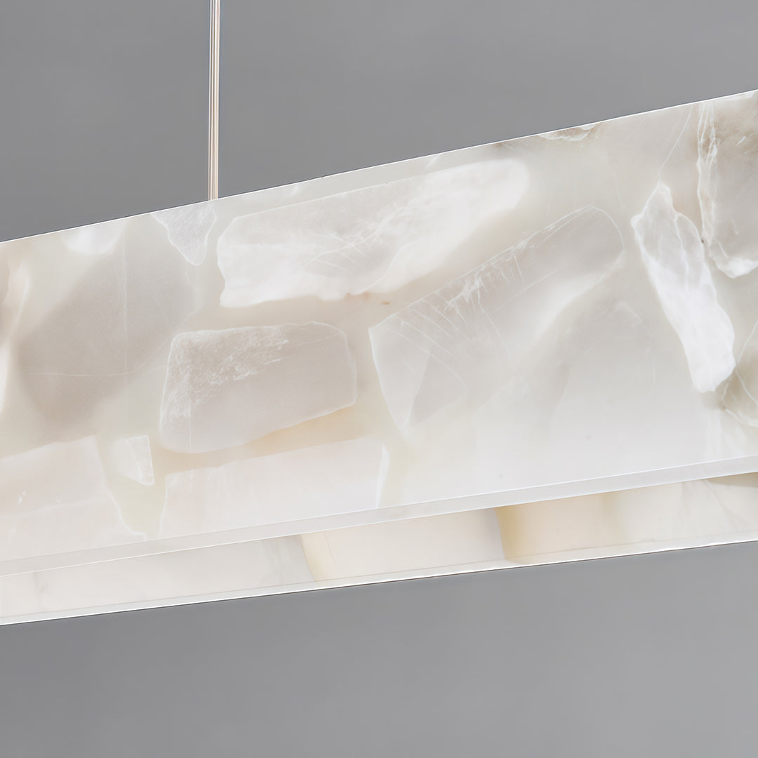 Enhance your decor with the copper metal pendant light, designed with a linear alabaster shade for a sophisticated and contemporary lighting solution.