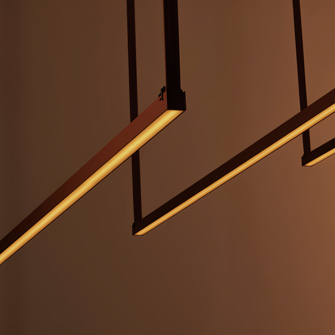 Stylish corridor with long pendant light fixtures, contemporary linear lighting design