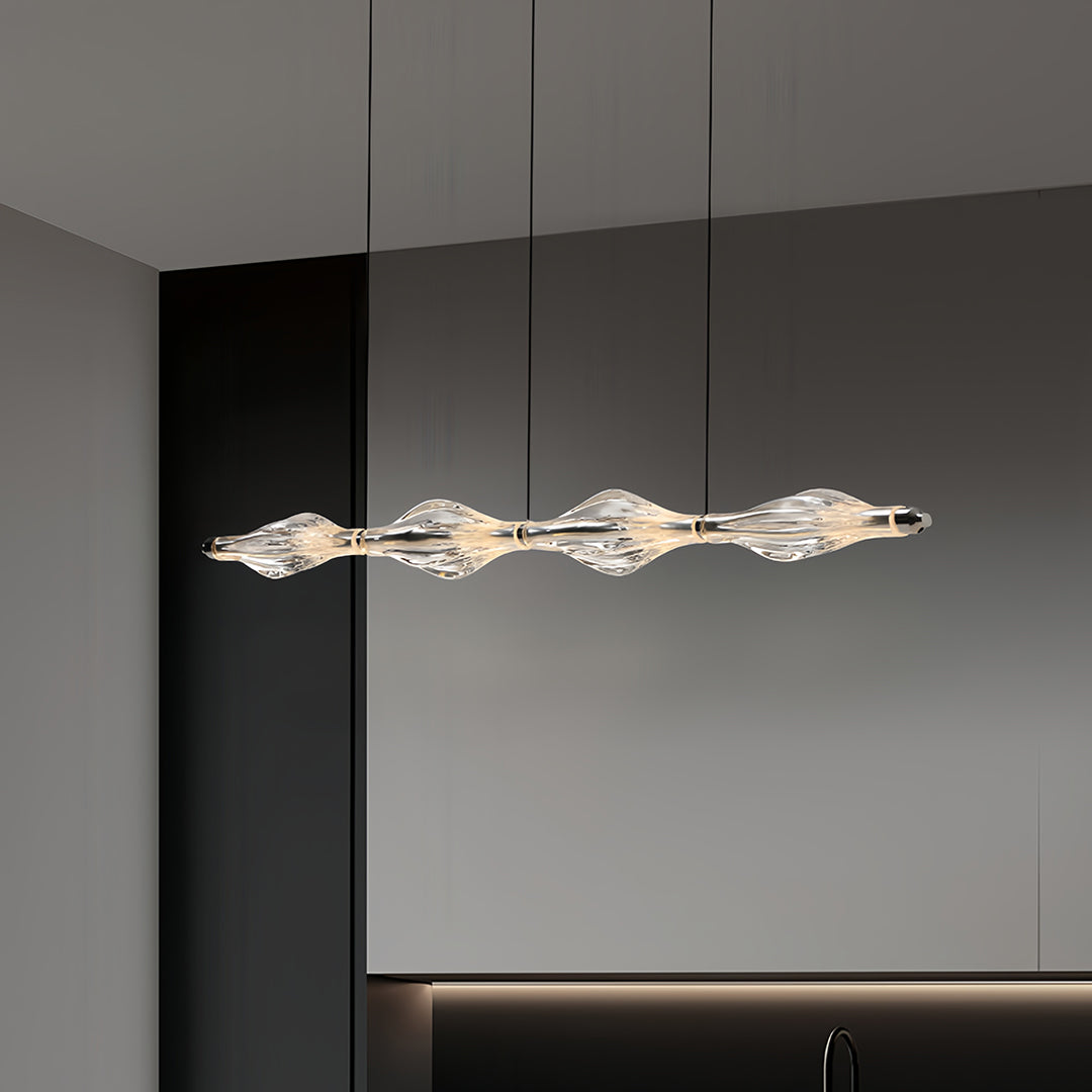 Stylish crystal pendant lights for kitchen island with a unique wavy design, enhancing a modern kitchen ambiance.