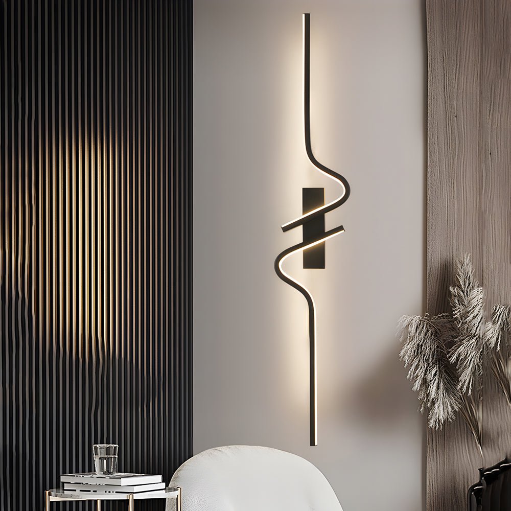 Stylish modern curved wall sconce in a bedroom, adding a touch of sophistication and warm lighting to the space.