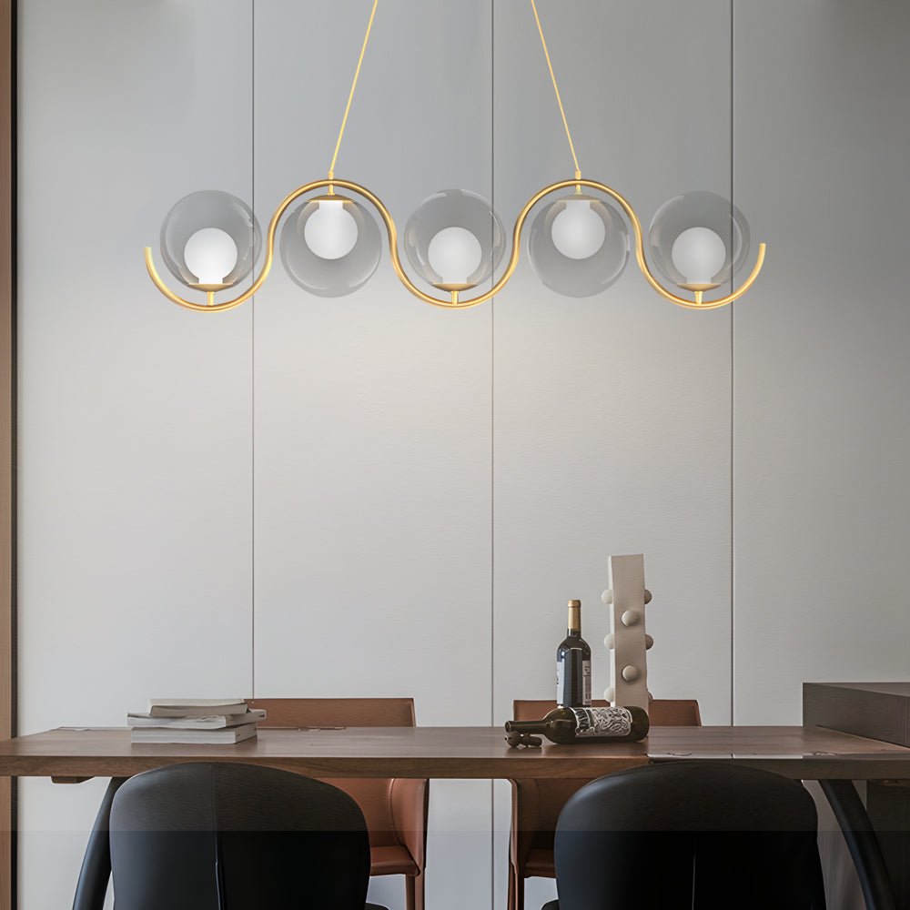 Stylish glass ball linear chandelier with soft white lighting and elegant gold accents, ideal for modern spaces.