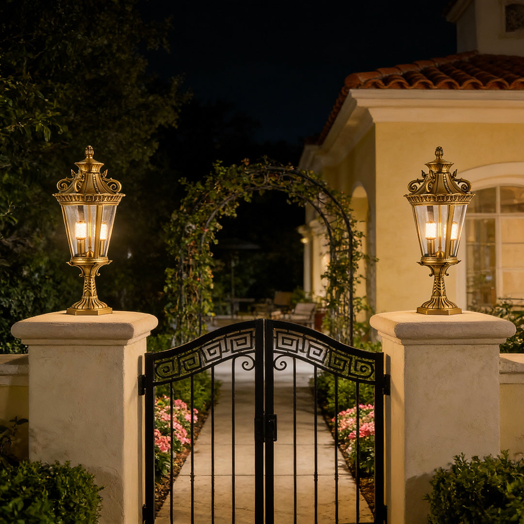 Stylish glass pillar lights on a stone fence, casting a welcoming glow for driveways and garden entrances.