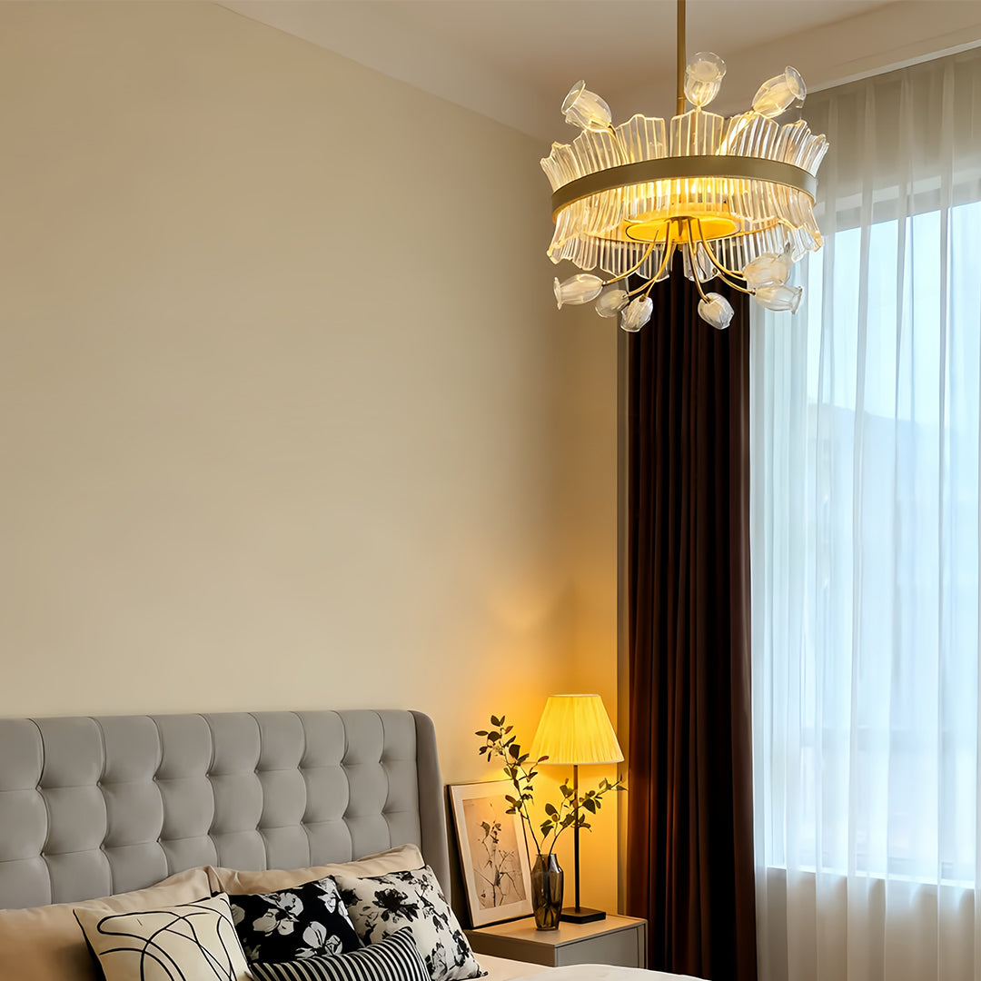 Stylish gold blossom chandelier with crystal details in a cozy bedroom