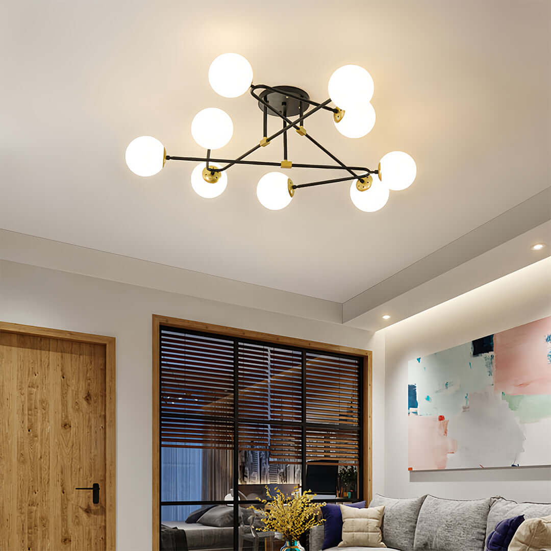 Stylish gold semi flush mount light installed in contemporary living room creating warm ambient lighting