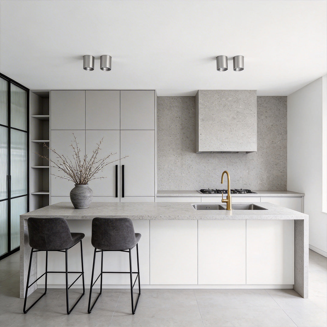 Stylish kitchen with silver ceiling spotlights highlighting the minimalist interior.