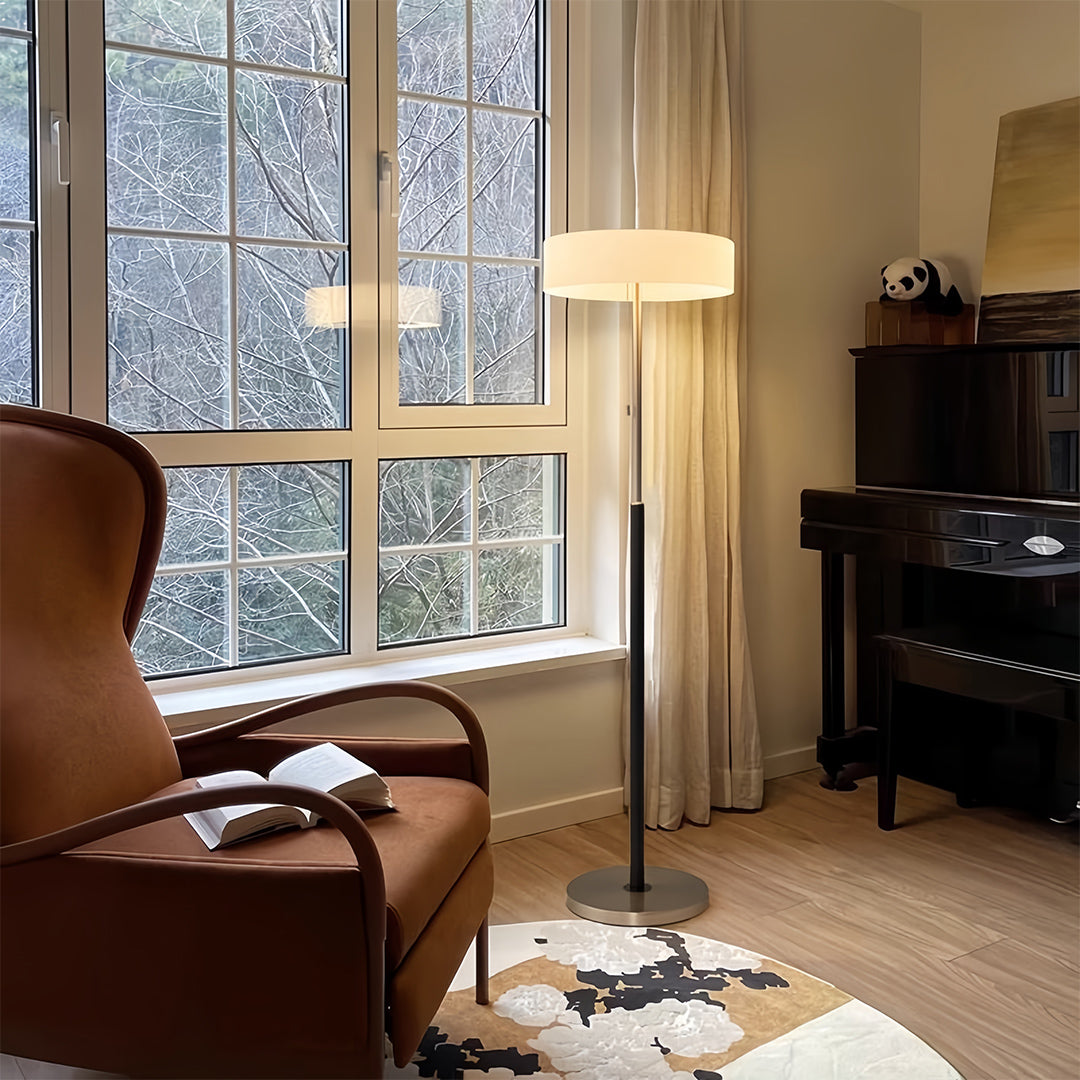 Stylish LED floor lamp illuminating modern interior with warm comfortable seating