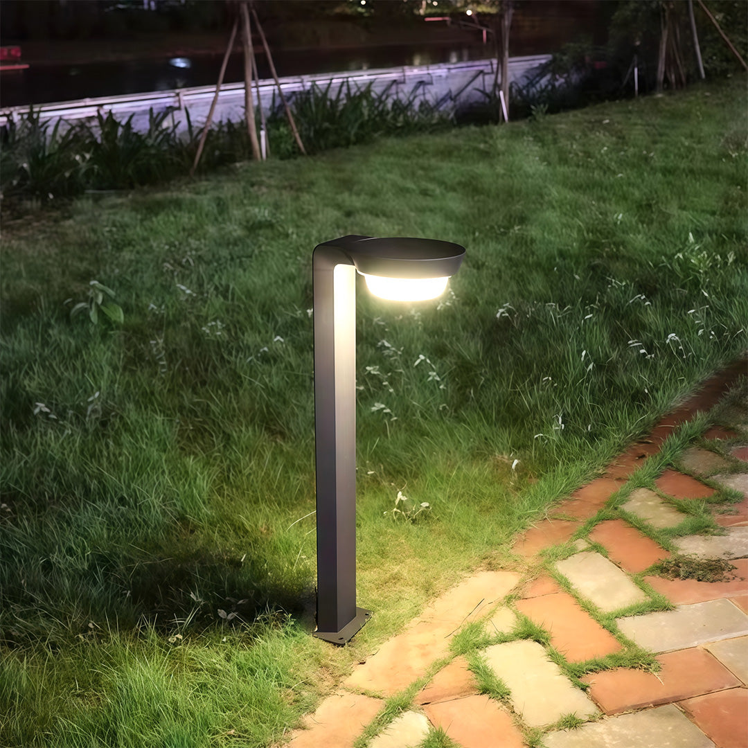 Stylish LED path lighting placed on a walkway, casting warm and inviting light across the outdoor setting.