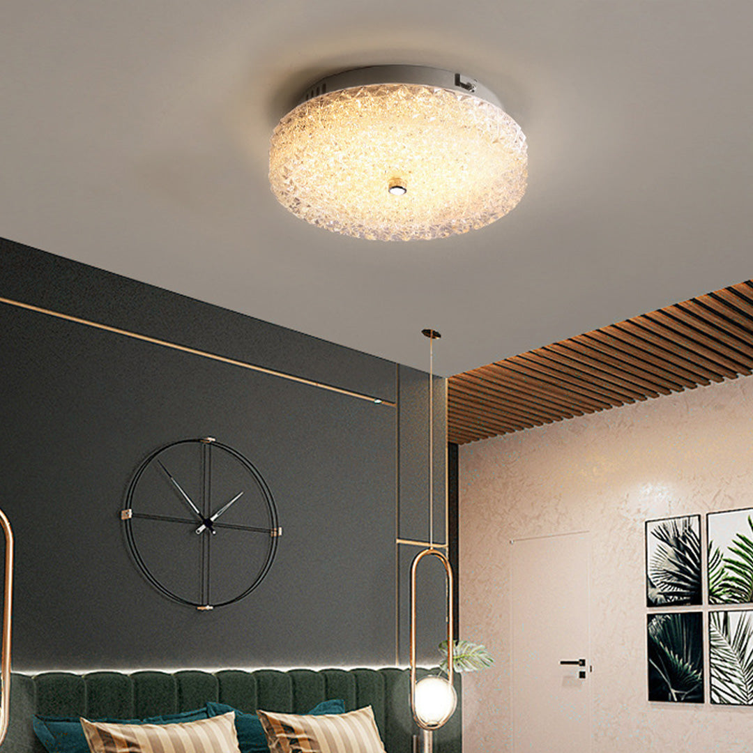 Stunning flush mount crystal ceiling light illuminating a stylish modern bedroom with dark walls.