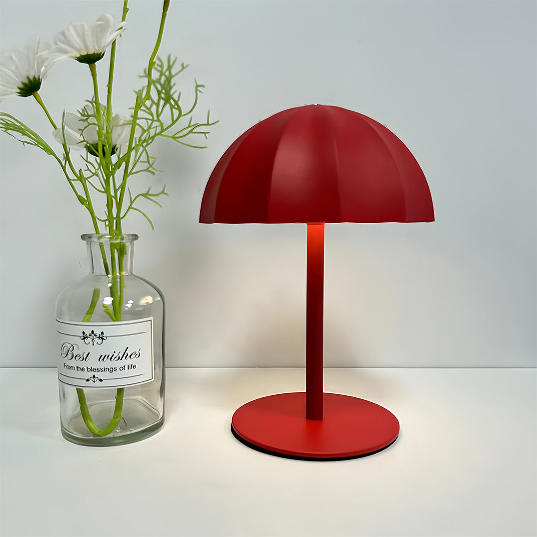Stylish red iron table lamps positioned next to decorative vase in modern interior
