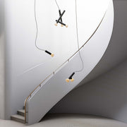 Black small pendant light in a stylish staircase, modern and functional lighting design