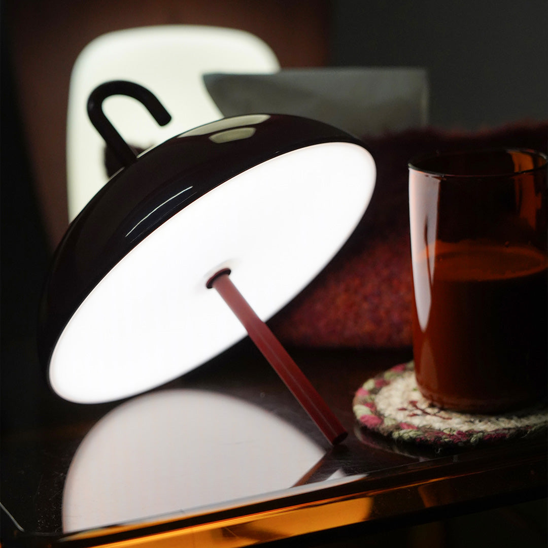 Stylish USB rechargeable table lamp with white interior providing focused task lighting