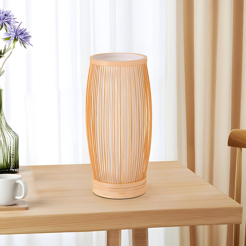 Stylish bamboo table lamp with vintage design, offering soft, ambient light for bedrooms or living rooms.