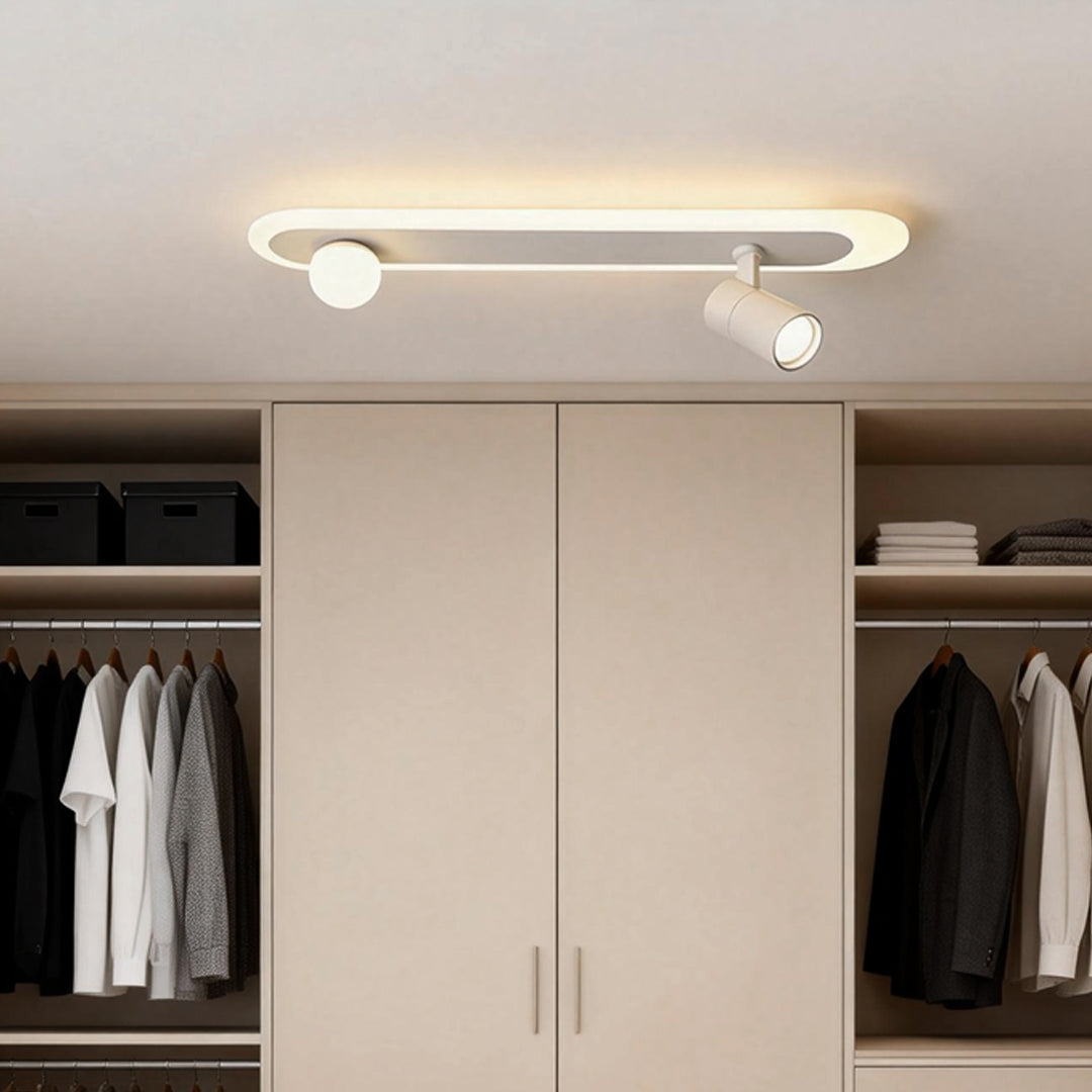 Surface mounted spotlights installed in a modern walk-in closet ceiling.