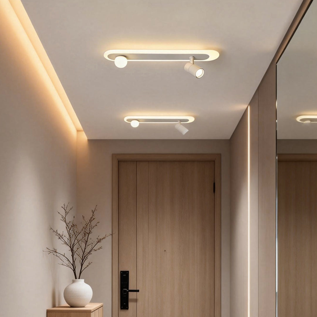 Surface mounted spotlights installed in a minimalist hallway ceiling.