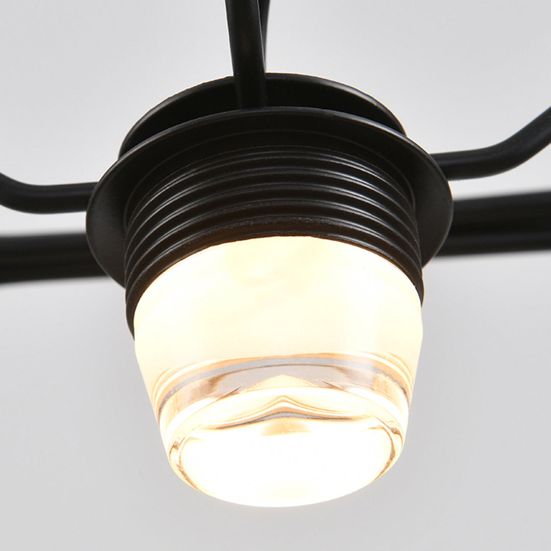 Suspended cube table lamp featuring ribbed glass shade and black metal mounting hardware