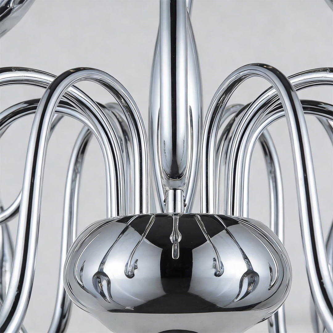 Close-up of swan chandelier polished chrome body and curved arms.