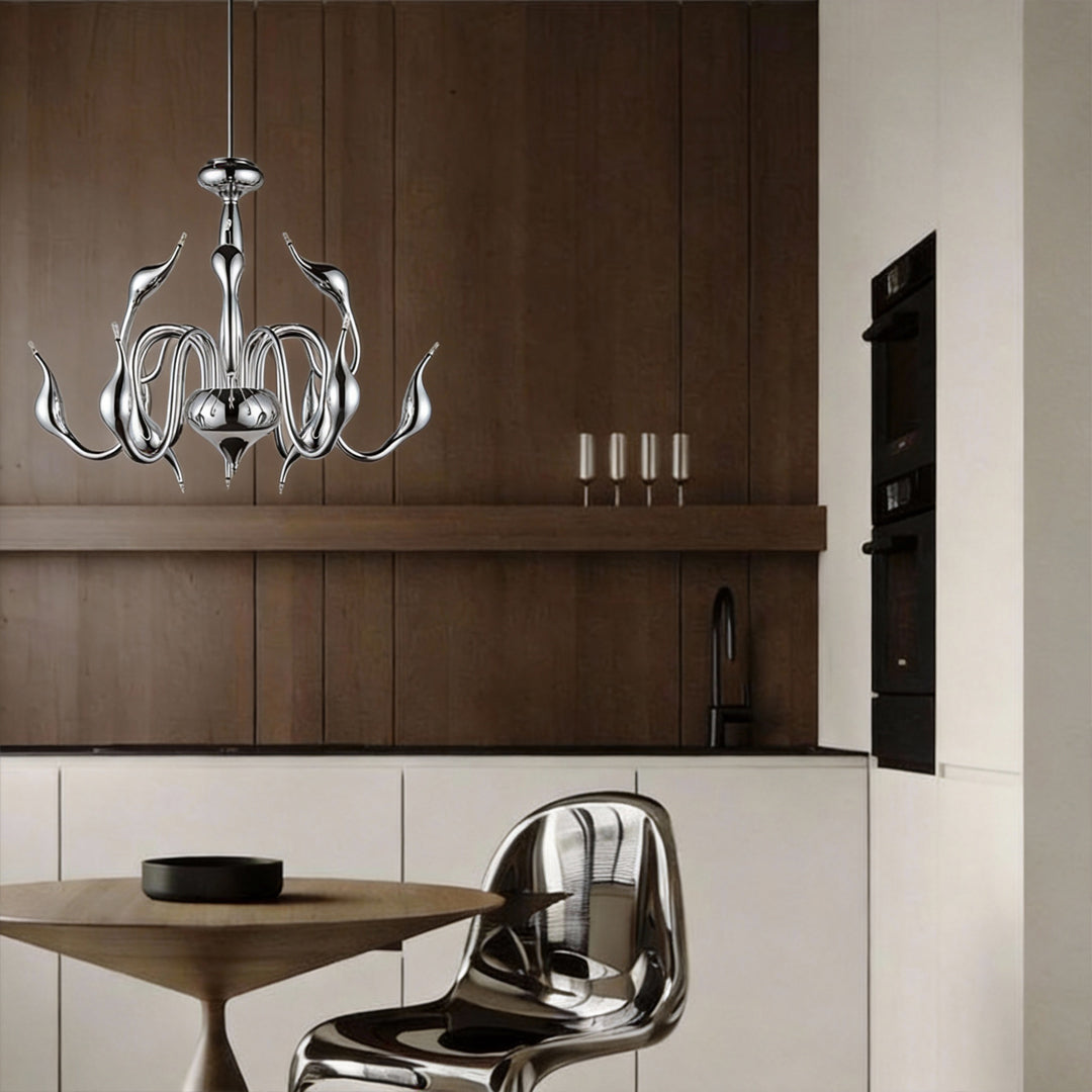 Swan chandelier in contemporary dining space with dark wood background.