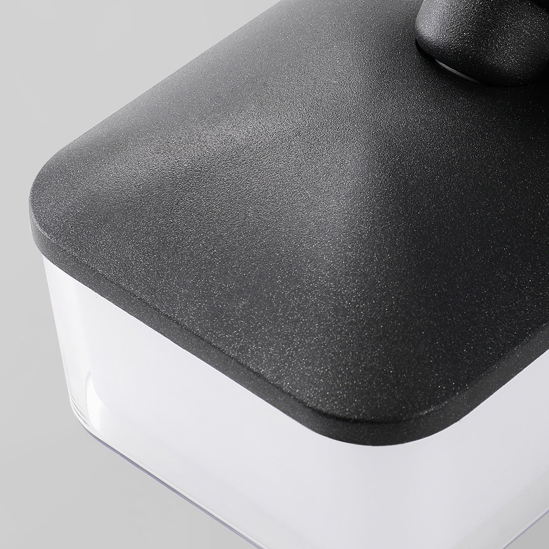 Soft-lit white swing wall light with modern hexagon shape and minimalist rounded mount detail.