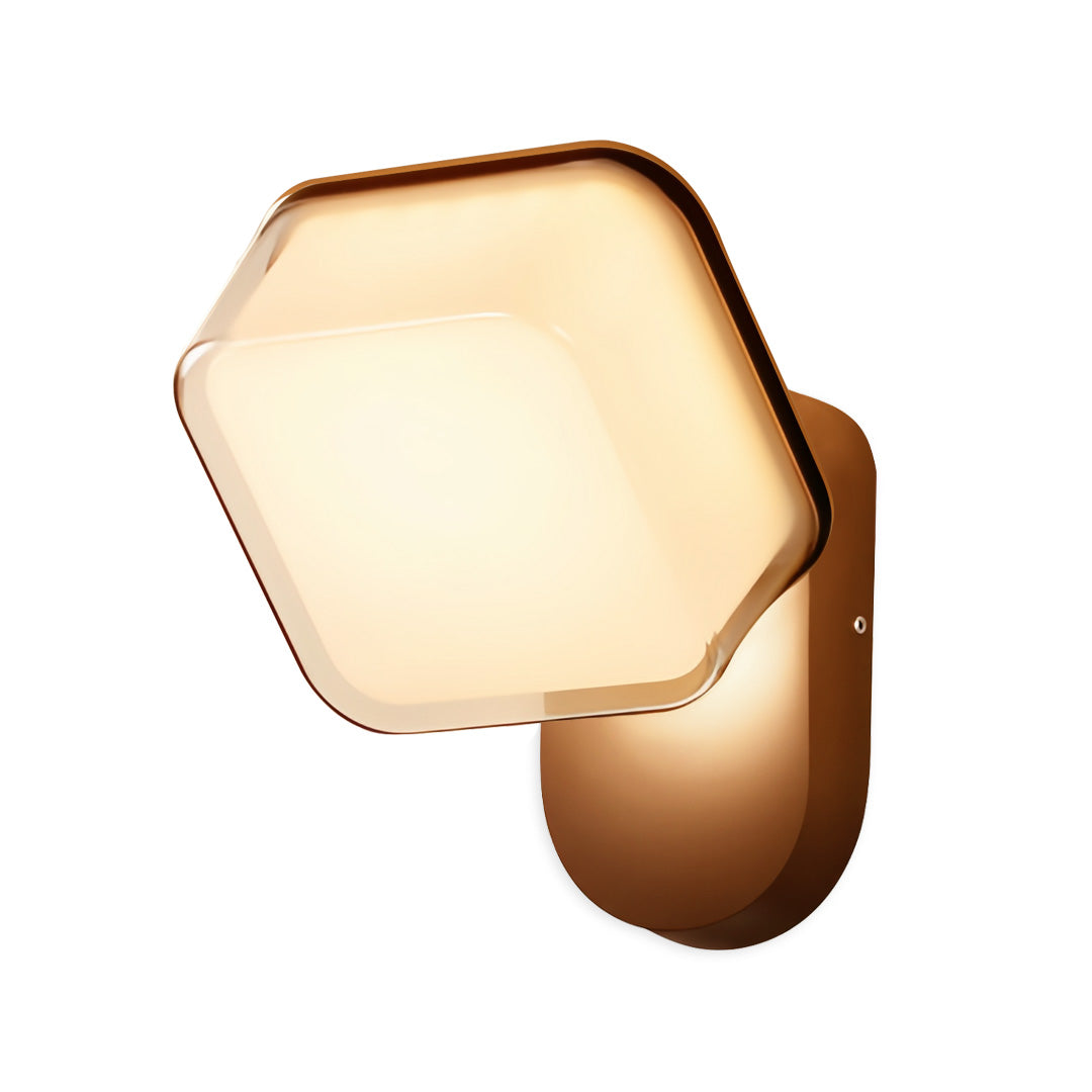 Warm-glow swing wall light with geometric hexagon design and bronze frame, ideal for ambient accent lighting.
