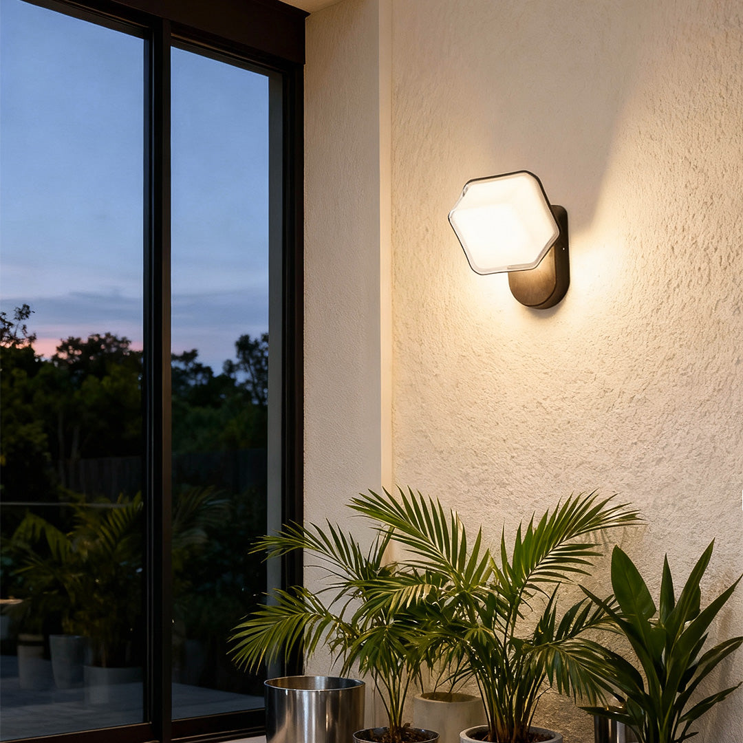 Hexagon swing wall light in white finish with curved mounting arm, designed for clean architectural style.