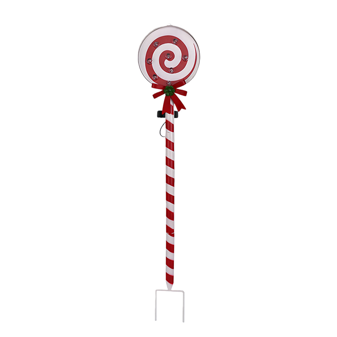 Red swirl candy-styled ground stake for Christmas lights featuring festive ribbon decoration.
