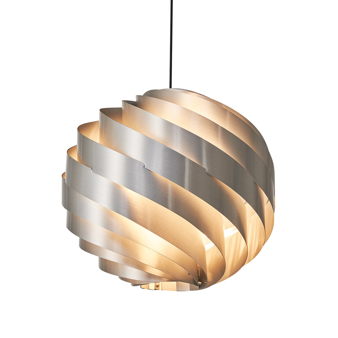 Golden swirl pendant light emitting warm light through spiral layers.