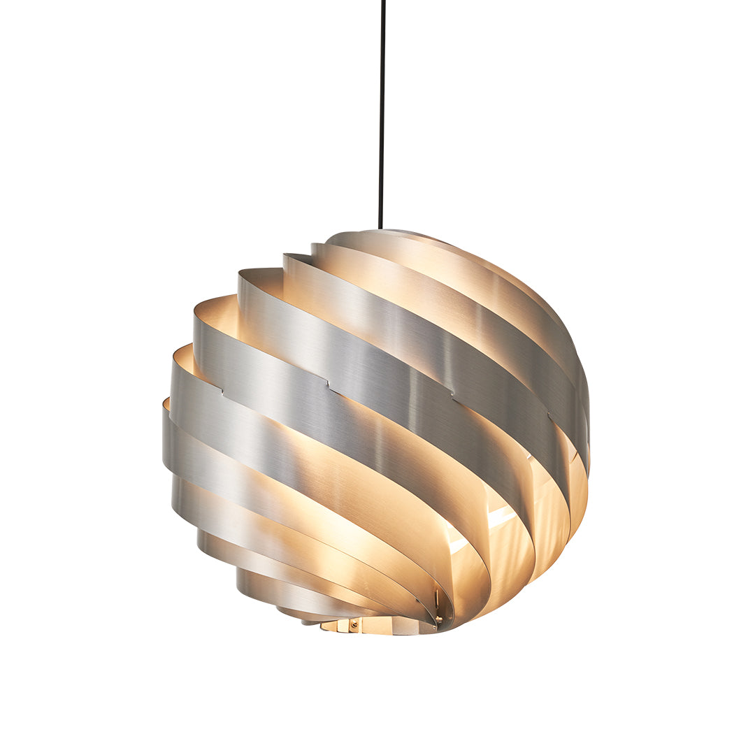 Warm gold swirl pendant light with layered spiral shade and glowing inner ring.