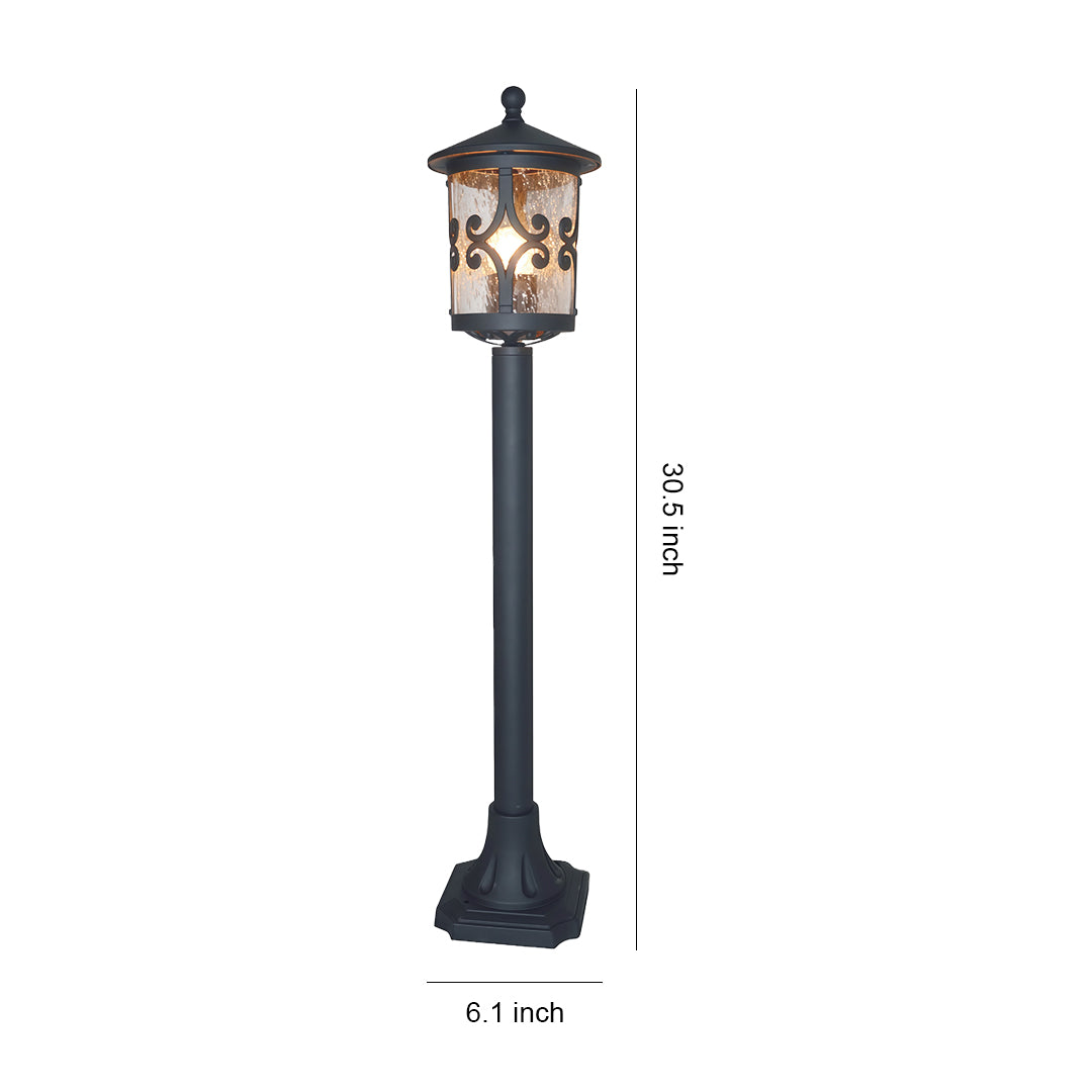 Tall bollard LED light with decorative scrollwork lantern top and slender black post, shown with height reference