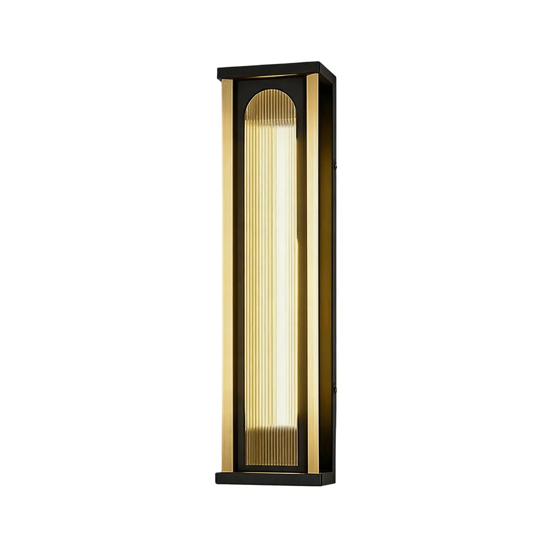 Tall outdoor wall sconce with black metal frame and vertical ribbed glass