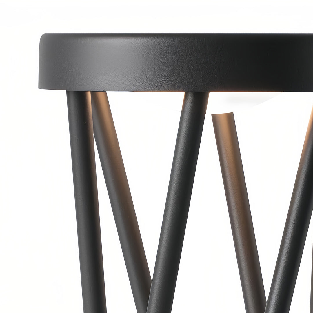 Set of tall bright path lights lining a poolside patio edge, enhancing the contemporary outdoor lounge area.