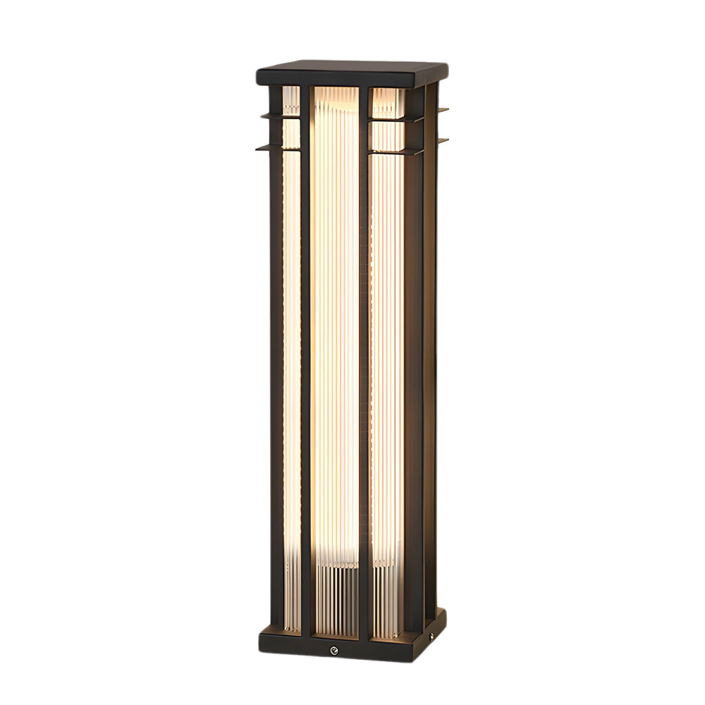 Tall rectangular bollard light with dark metal frame and vertical glass panel for modern pathway lighting
