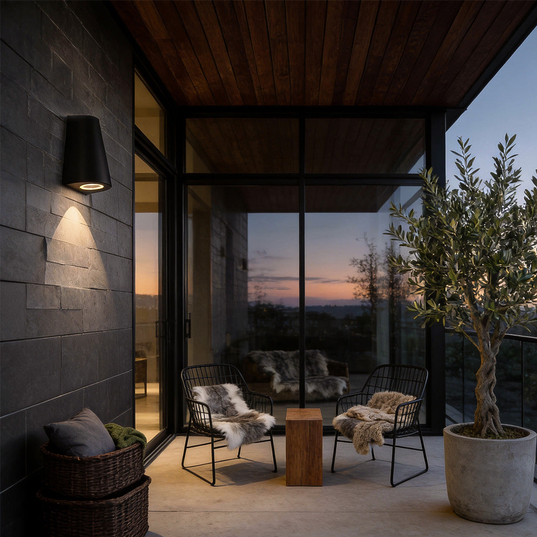 Tapered wall light enhancing a contemporary outdoor space with soft light.