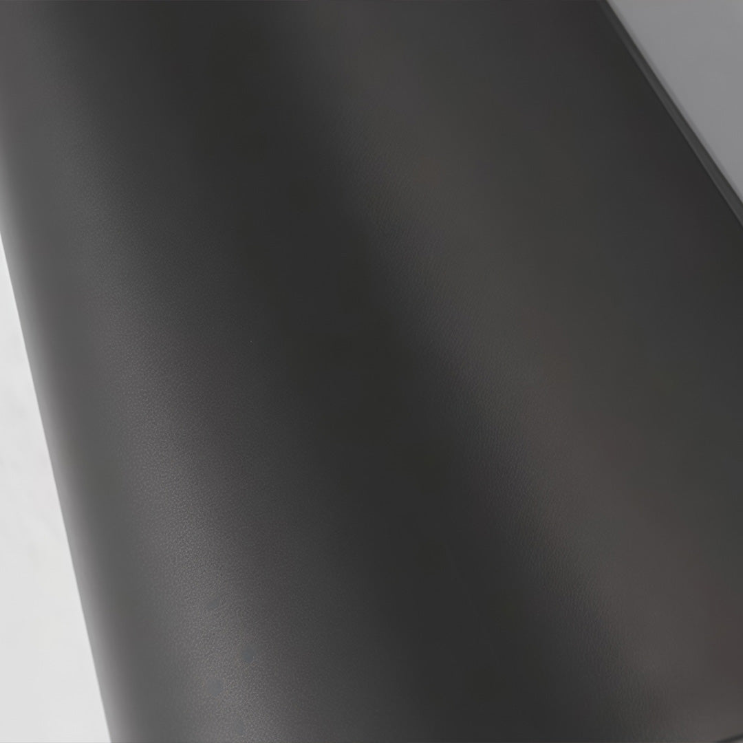 Tapered wall light showcasing the tapered design and warm illumination. 