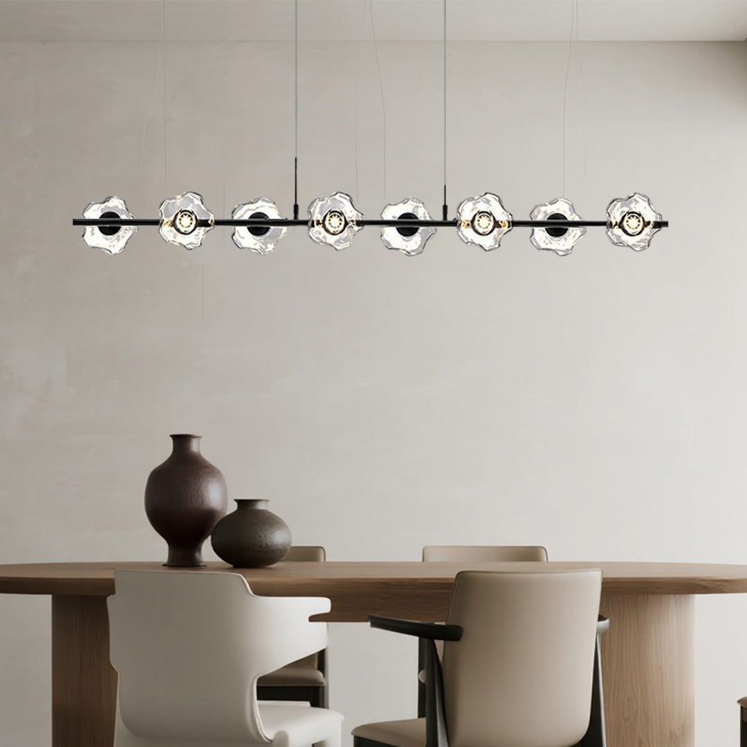 Premium linear pendant chandelier providing elegant task lighting in modern dining area with multiple glass bulbs