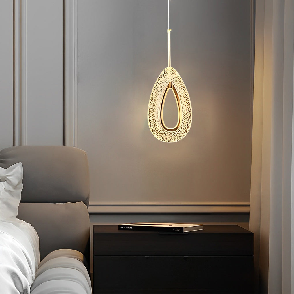 Teardrop-shaped unique pendant light installed beside a bed.