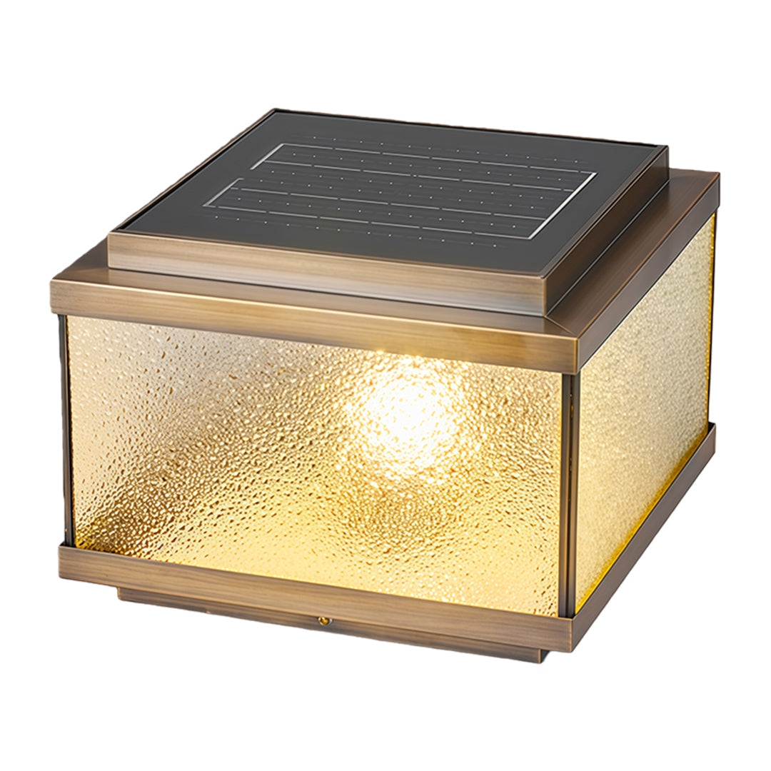 Decorative garden pillar light with textured glass panels emitting warm ambient outdoor lighting