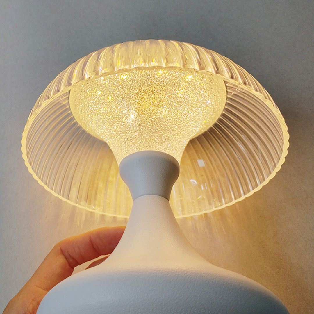 Close-up of the textured, sparkling light effect inside the clear shade of the table unique lamps.