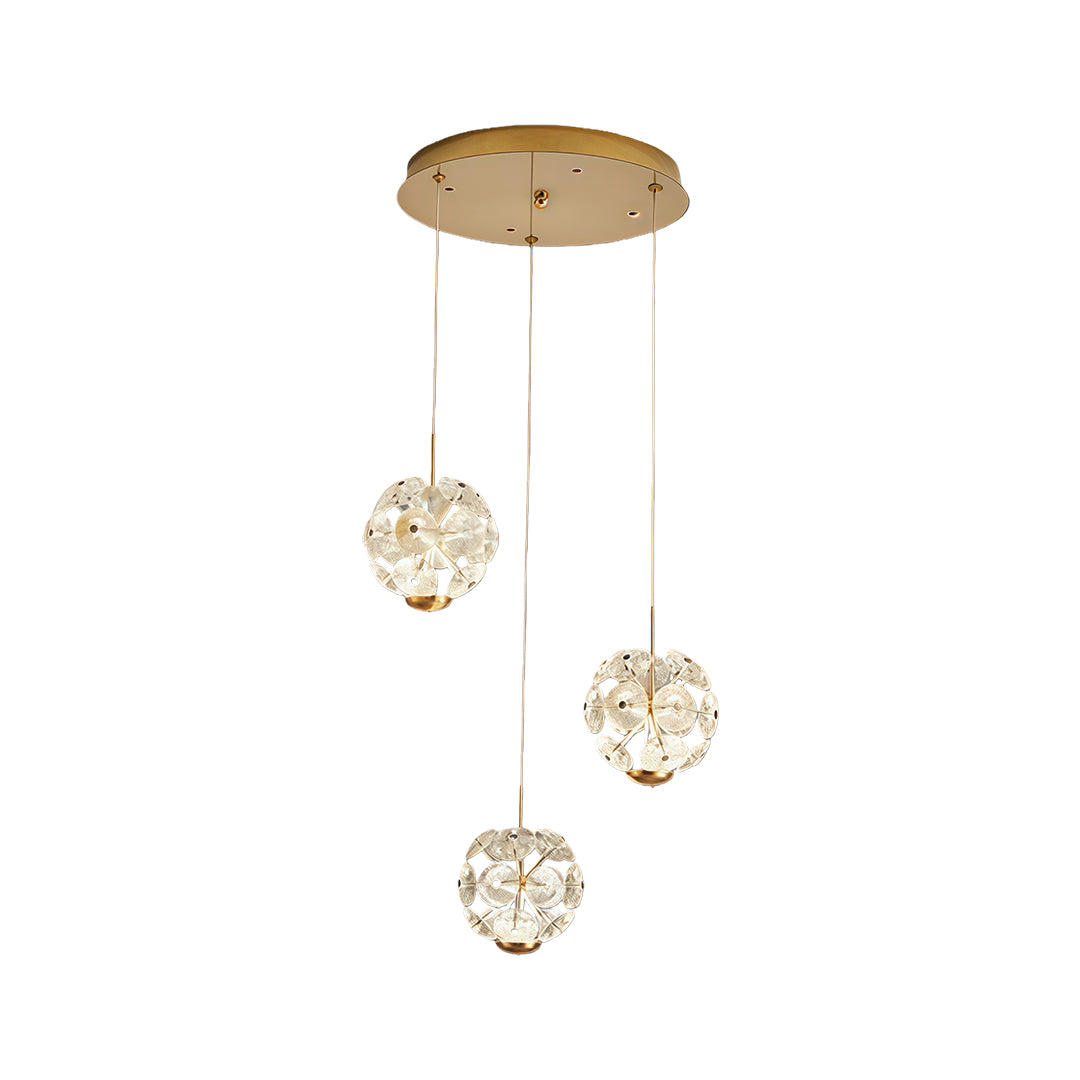 Three-ball gold staircase crystal chandelier hanging from a round ceiling plate.