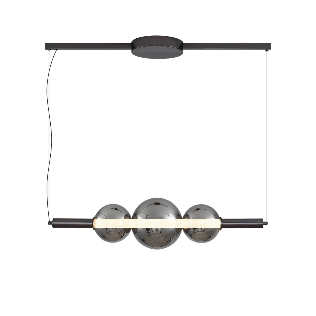 Modern silver pendant light for kitchen island with three clear globe shades suspended on black linear track