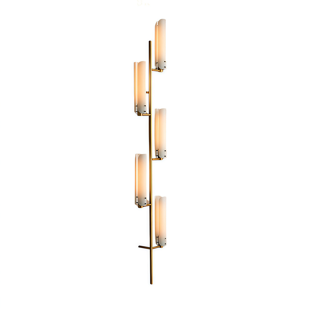 Three-light vertical brass wall light with glass shades arranged in ascending pattern on gold finish.