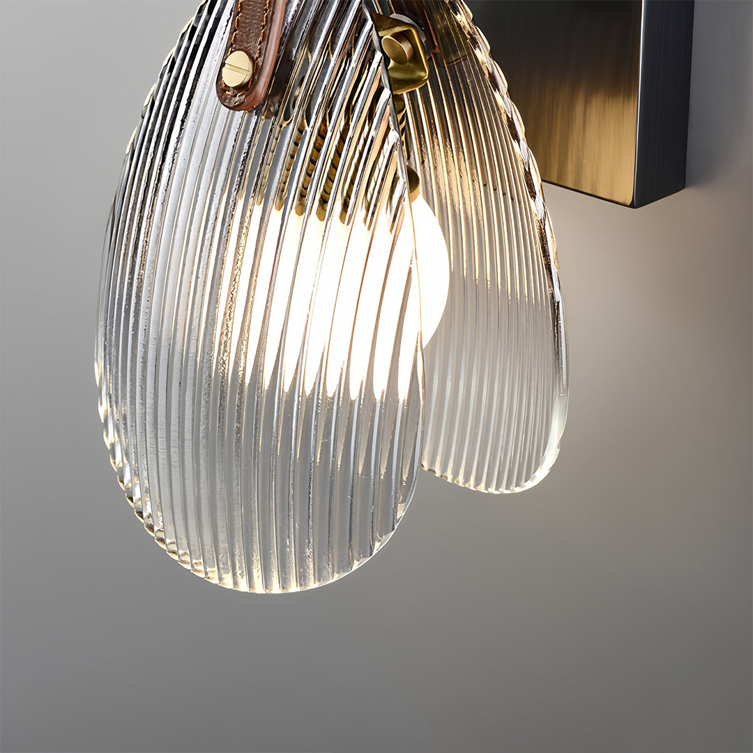 Large tiered hanging glass pendant light with crystal-like design creating dramatic ceiling feature