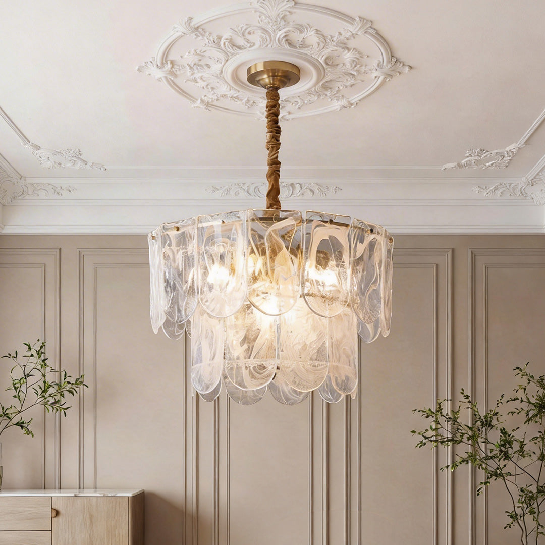 Luxurious tiered glass drum chandelier with scalloped panels and warm glowing LEDs, suspended.