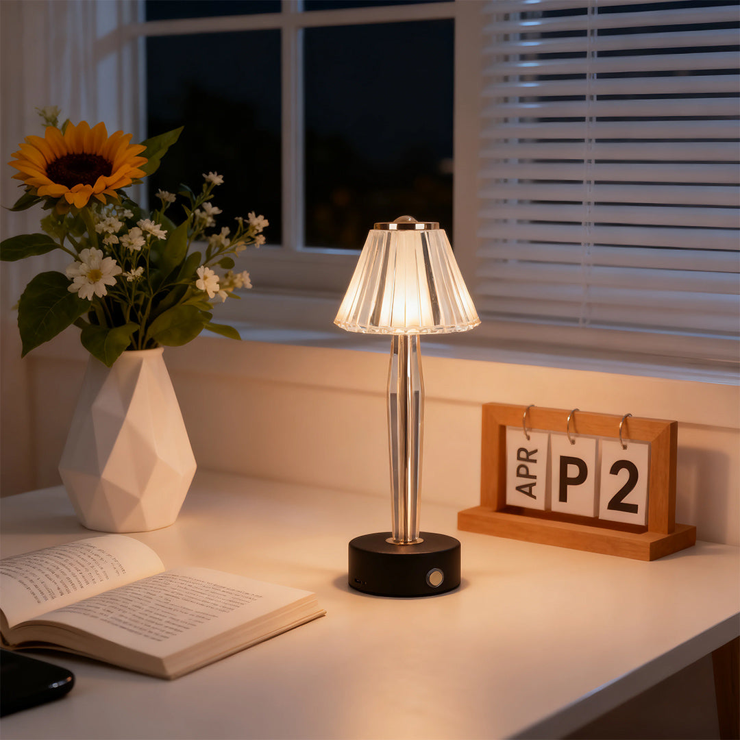 Timeless classic table lamp creating a warm evening ambiance on a desk with a vintage perpetual calendar.