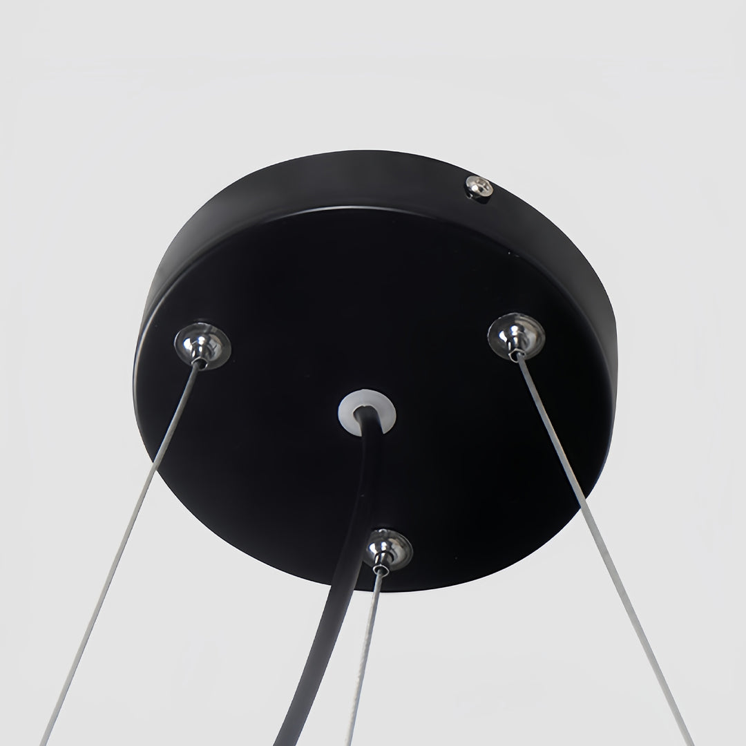 Top-down view of a black modern chandelier, highlighting its sleek, clean edges and modern aesthetic.