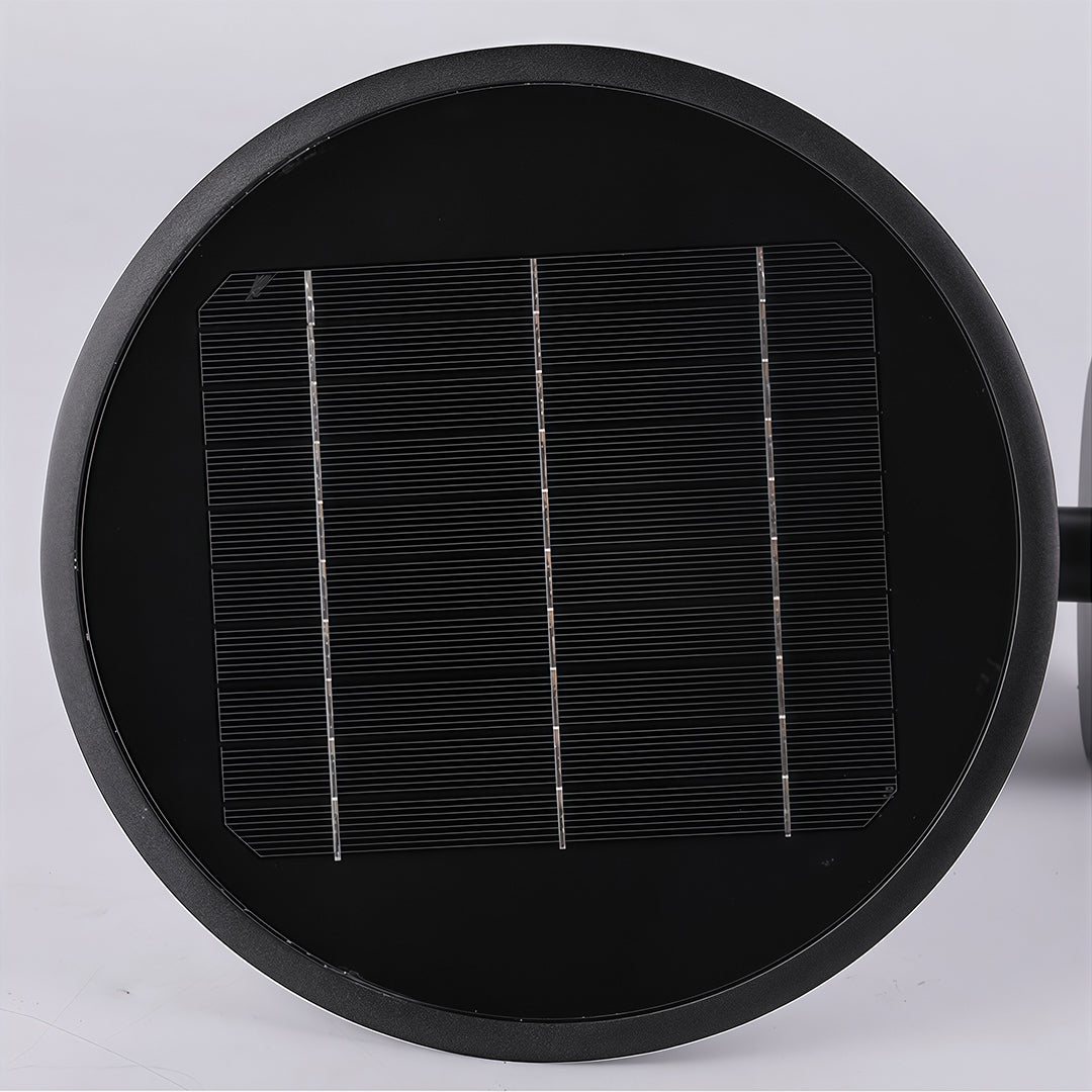Top-down view of the outdoor solar wall sconce showcasing its round, 'halo-style' solar panel.