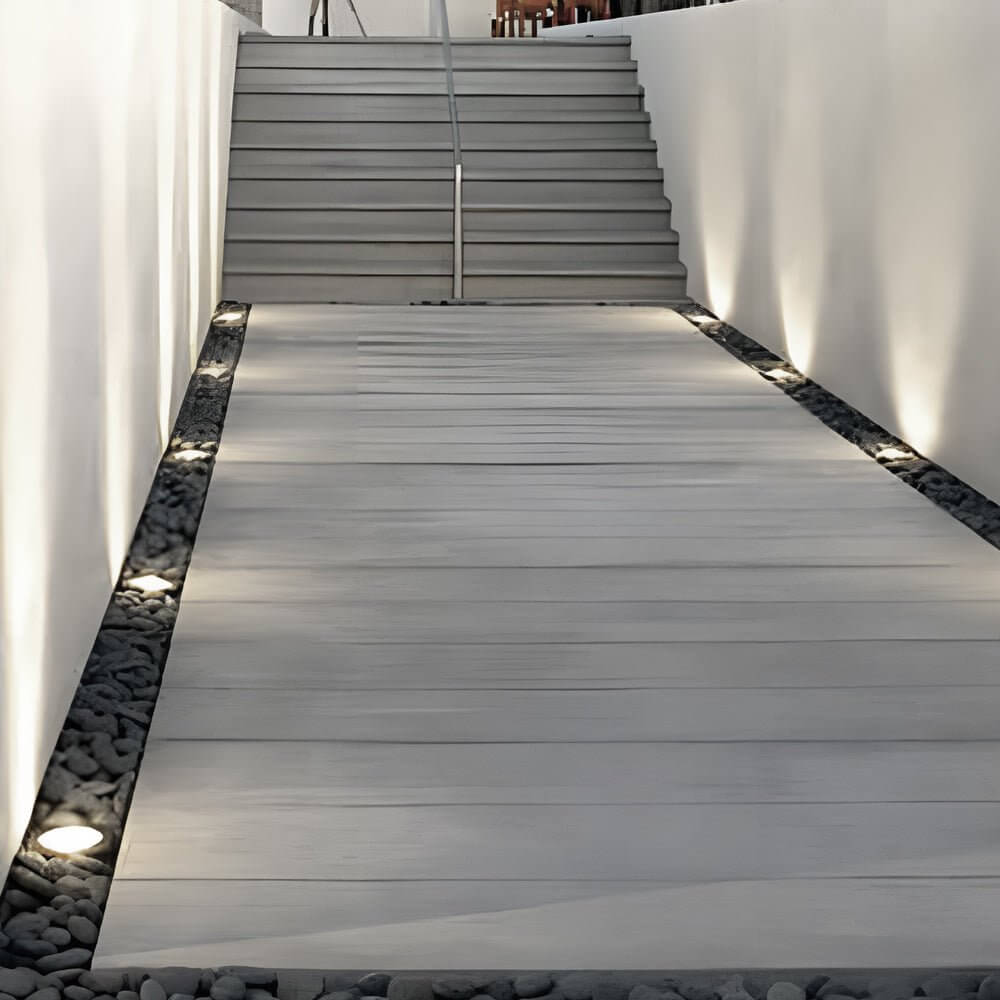 Top view of recessed floor lighting showing solar panel and LED bulbs for energy-efficient outdoor lighting.