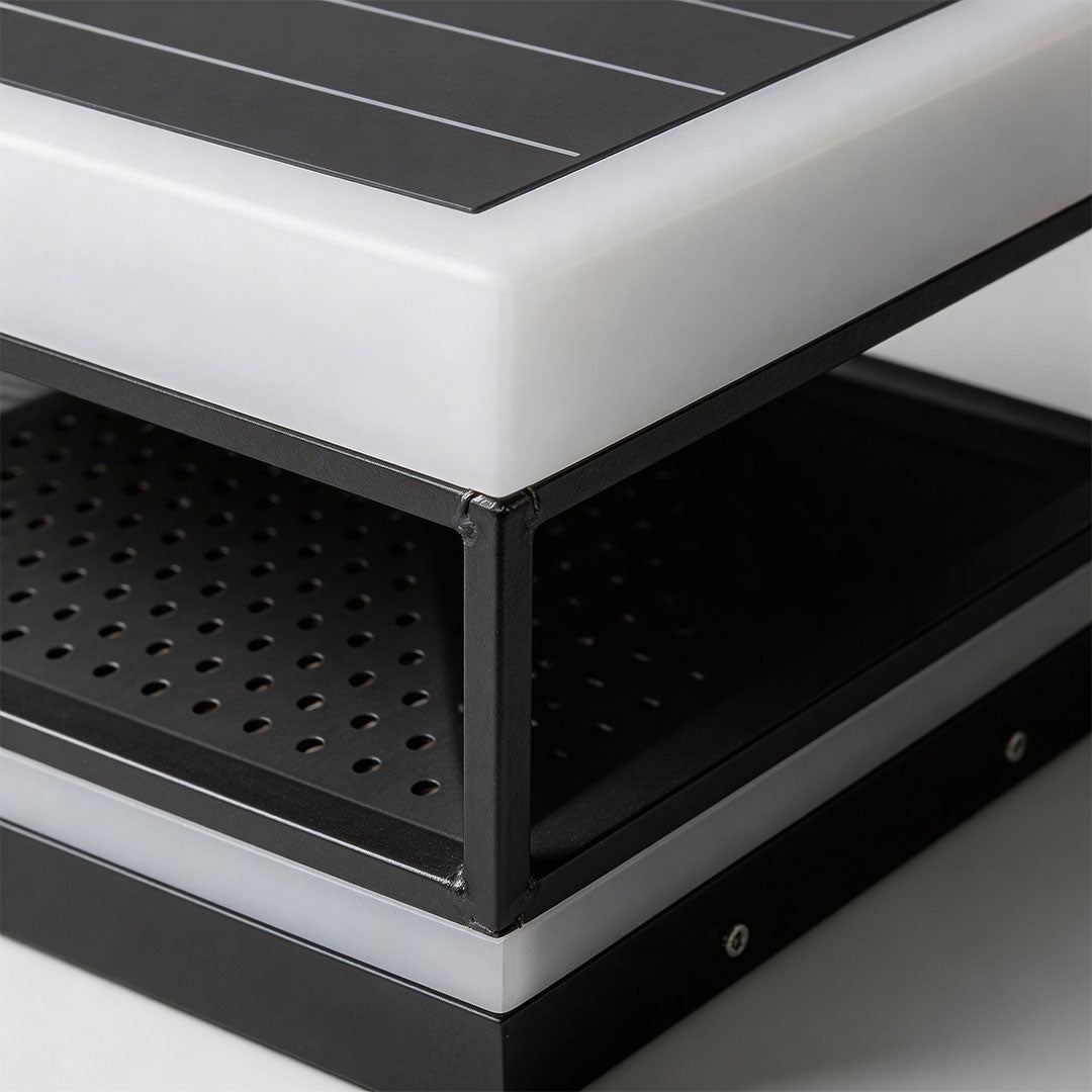 Top view of a white pillar top light showcasing its perforated pattern and minimalist structure.